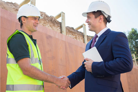 Recycler shaking hands with big business